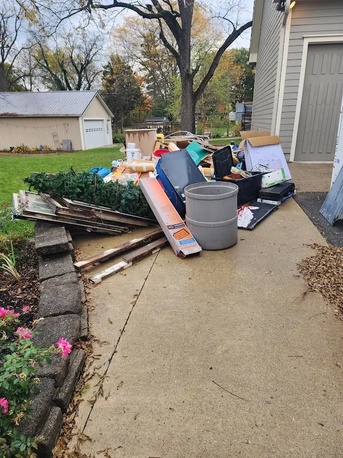 Dumpster being loaded with debris for Residential Dumpster Rental in Thousand Palms